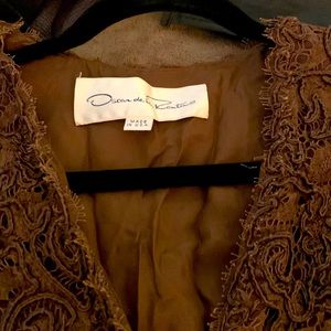Oscar de la Renta jacket Loved and so has wear on the inside underarms.